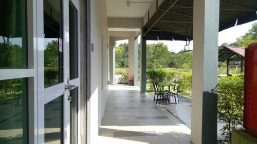 an open door of a house with a patio at Selesa View Gambang in Simpang Pulau Manis