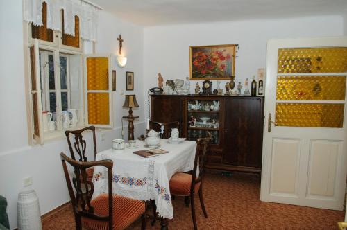 a dining room with a table with a white table cloth at Fónagy és Walter Vendég- és Borház in Vác