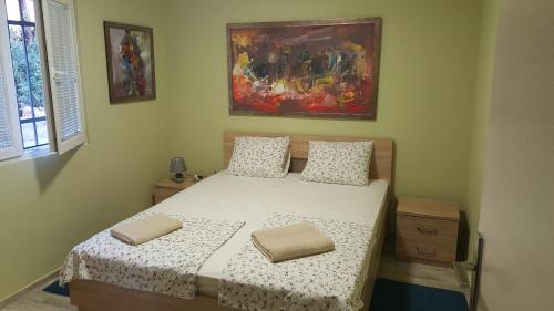 Postel nebo postele na pokoji v ubytování Apartments Kli Kli