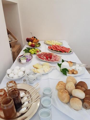 a table with many plates of food on it at Antica Masseria Torre Mozza in Torre Santa Susanna