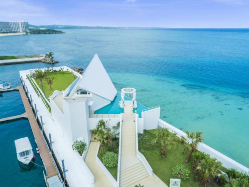 an aerial view of a house on the water at Sheraton Okinawa Sunmarina Resort in Onna