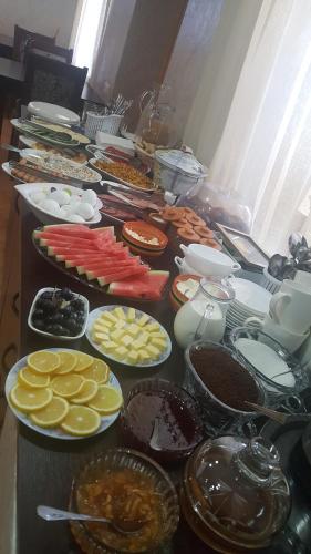 a table topped with lots of different types of food at Mestia 4 season in Mestia