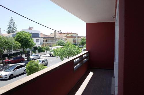 a balcony of a building with a view of a street at Lisbon Beach Apartments 3 in Costa da Caparica
