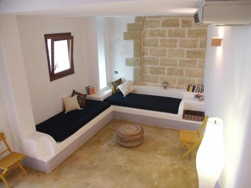 Postel nebo postele na pokoji v ubytování B&B Masseria Dei 12 Granai