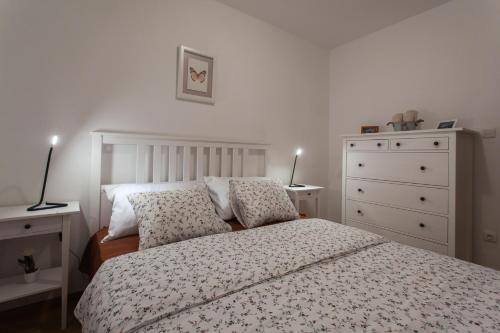 Кровать или кровати в номере Apartment Lyra