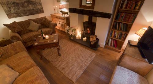 an overhead view of a living room with a fireplace at Blue Bell Cottage in Ollerton