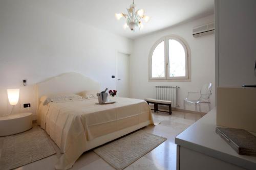 En eller flere senge i et værelse på Villa Maria Clara by Perle di Puglia