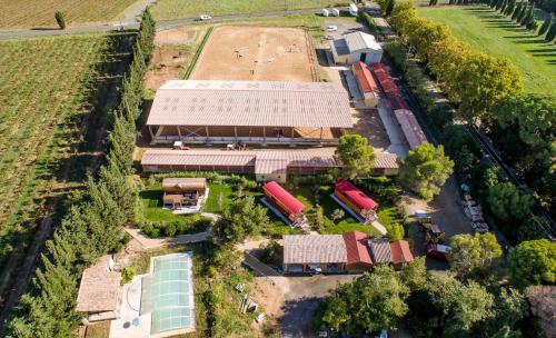 an overhead view of a farm with a train station at Les Gites De La Serre in Saint-Thibéry