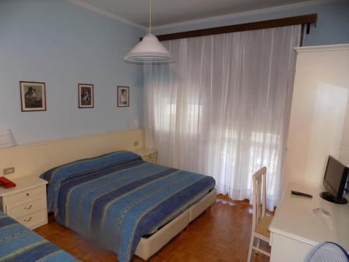 Postel nebo postele na pokoji v ubytování Hotel Udinese da Aldo