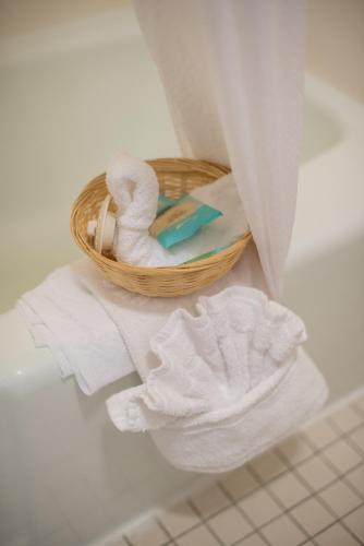 a basket of towels and a basket of towels at Motel 8 Rock Springs in Rock Springs