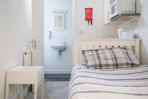 Ένα ή περισσότερα κρεβάτια σε δωμάτιο στο TLK Apartments & Hotel - Beckenham Junction
