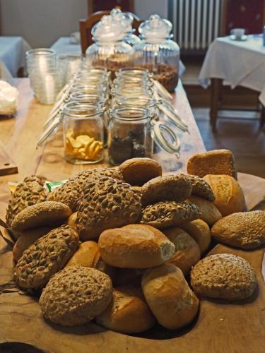 a table topped with lots of bagels on top at Schloss Spangenberg in Spangenberg