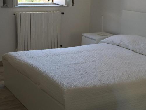 Tempat tidur dalam kamar di Sicily Holidays
