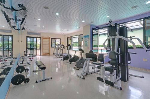 a gym with treadmills and elliptical machines at São Paulo Higienópolis Affiliated by Meliá in São Paulo