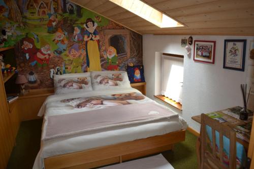 Кровать или кровати в номере B&B La Tana dell'Orso - Die Bärenhöhle