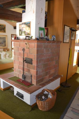 a model of a brick fireplace in a room at B&B La Tana dell'Orso - Die Bärenhöhle in Castello di Fiemme