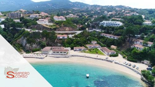 an aerial view of a beach next to the ocean at Hôtel Sampiero in Propriano