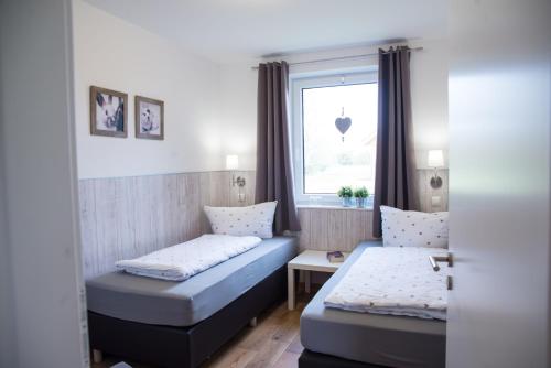 Postel nebo postele na pokoji v ubytování Ferienhaus Biber