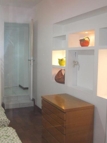 a room with a dresser and a room with a door at Star Hostel in Milan