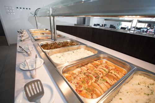 a buffet line with many different types of food at Mandali Hotel in Protaras