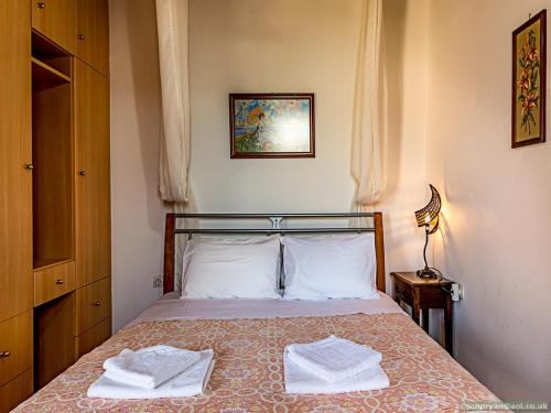 Voodi või voodid majutusasutuse Fotinis Cottage toas