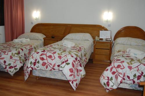 Un pat sau paturi într-o cameră la Gran Hotel Vedra