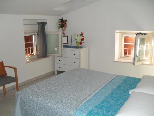 Ένα ή περισσότερα κρεβάτια σε δωμάτιο στο Lovelyflat ALBISANO