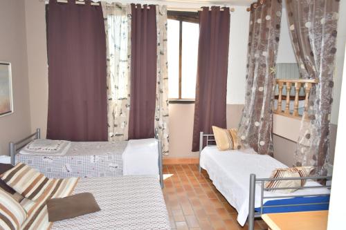Кровать или кровати в номере Appartements Luccisano