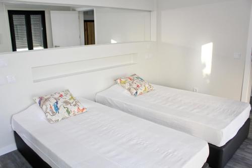 Postel nebo postele na pokoji v ubytování Casa das Andorinhas
