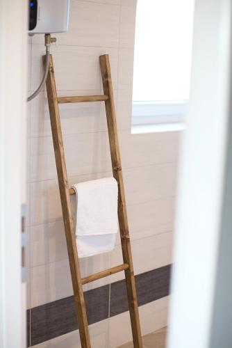 a ladder in a bathroom with a towel at Villa Gellia in Ugljan