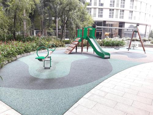 a playground with a slide in a park at Bluesky Serviced Apartment Airport Plaza in Ho Chi Minh City