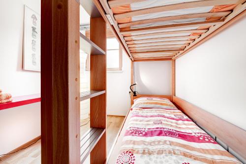 A bed or beds in a room at Appartement Ski In by A-Appartments