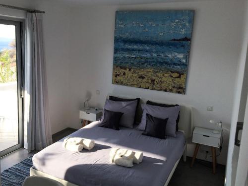 a bedroom with two beds with towels on them at Galini Breeze in Agia Galini