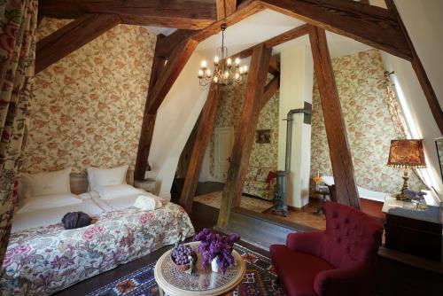 a bedroom with a bed and a mirror at Liepupe Manor in Liepupe