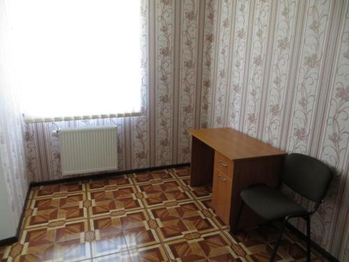 an office with a desk and a chair and a window at Vershnyk in Cherkasy