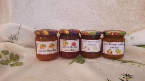 a group of three jars of jam on a table at Familien-Appartements Örglwirt's Gut in Mariapfarr