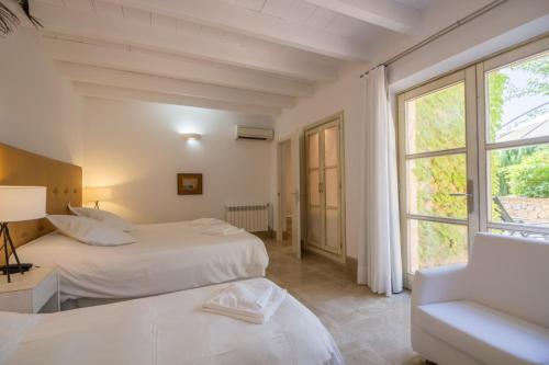 Cama ou camas em um quarto em Alcudia - 19466 Mallorca