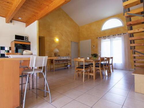 a kitchen and dining room with a table and chairs at Peaceful Villa in Calamane with Private Pool in Calamane