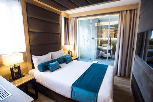 Letto o letti in una camera di Eden Luxury Suites Terazije