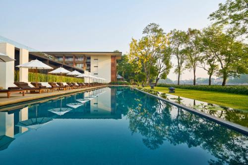 an image of a swimming pool at a resort at Anantara Chiang Mai Resort in Chiang Mai