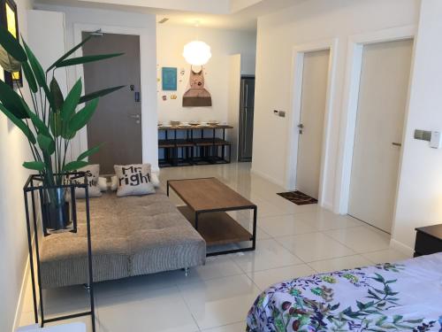 a living room with a couch and a table at Great Value Family Apartment to Family Apartment @ M-City in Kuala Lumpur
