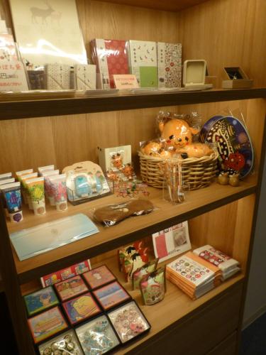 a shelf filled with lots of christmas items at Hotel Hanakomichi in Nara