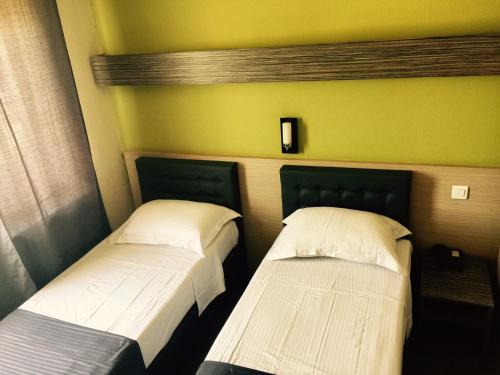 Un ou plusieurs lits dans un hébergement de l'établissement Hotel Prince de Liege