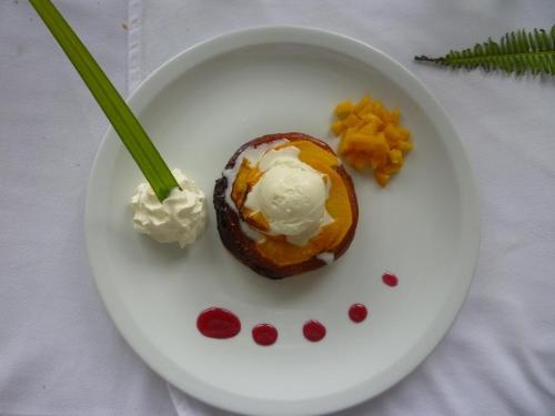 a white plate with an eggplant with ice cream and vegetables at Le Relais de la Maroto in Pirae