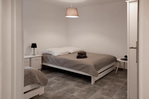 Ein Bett oder Betten in einem Zimmer der Unterkunft Apartamenty w starym browarze 1