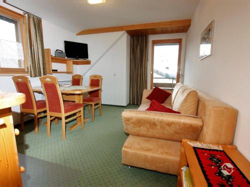 a living room with a couch and a table at Gästehaus Wissler in Todtnau