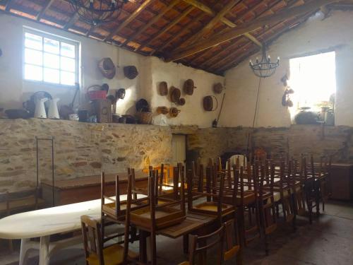a room with a bunch of tables and chairs at Porto Countryside House in Aguiar de Sousa