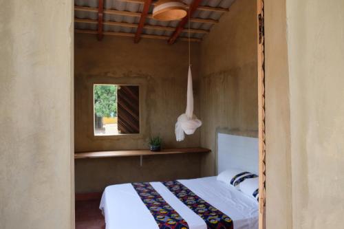 Tempat tidur dalam kamar di Centre Touristique et Culturel Casamance