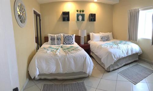 Katil atau katil-katil dalam bilik di Quinta Pacifica Beachfront Villas