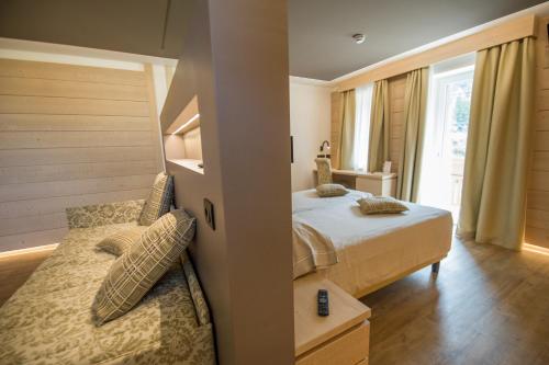 Postel nebo postele na pokoji v ubytování Hotel Bezzi